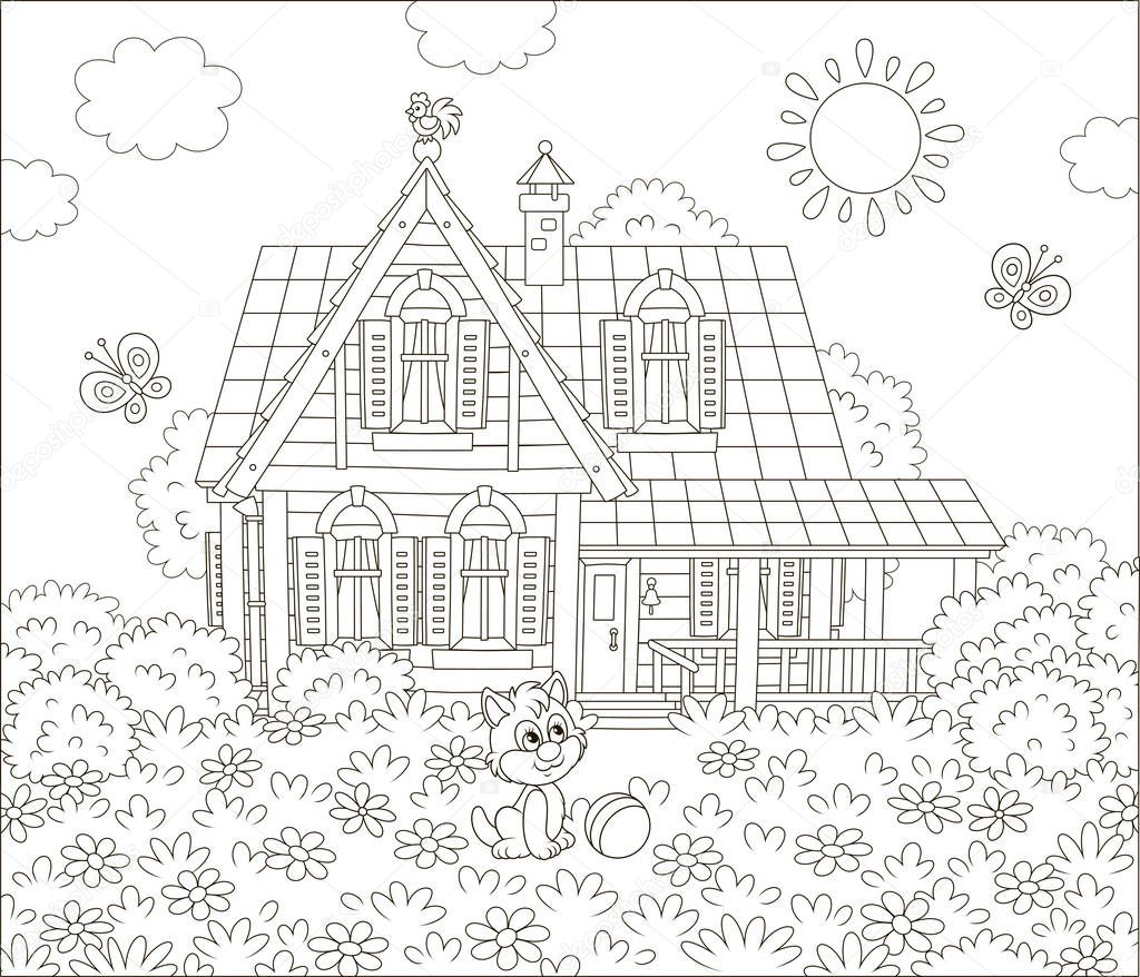 Village house and a small kitten playing with butterflies among flowers on grass of a lawn, black and white vector illustration in a cartoon style for a coloring book