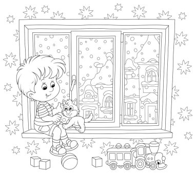 Karlı bir kış gününde küçük kediciğiyle çocuk odasının penceresinde oynayan gülümseyen çocuk, bir boyama kitabı için bir çizgi film tarzında siyah beyaz vektör çizimi