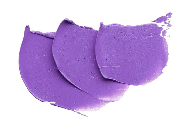 Purple makeup smear of lip gloss isolated on white background. Purple lipstick texture isolated on white background. Broken purple lipstick