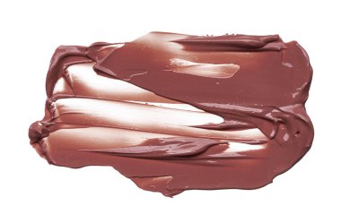 Doku beyaz arka plan üzerinde izole kahverengi ruj. Smear kırık kahverengi dudak parlatıcısı veya krem göz farı beyaz bir arka plan üzerinde izole. Beyaz izole kahverengi krem Vakfı doku