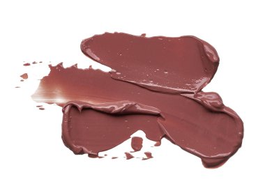 Doku beyaz arka plan üzerinde izole kahverengi ruj. Smear kırık kahverengi dudak parlatıcısı veya krem göz farı beyaz bir arka plan üzerinde izole. Beyaz izole kahverengi krem Vakfı doku