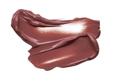 Doku beyaz arka plan üzerinde izole kahverengi ruj. Smear kırık kahverengi dudak parlatıcısı veya krem göz farı beyaz bir arka plan üzerinde izole. Beyaz izole kahverengi krem Vakfı doku