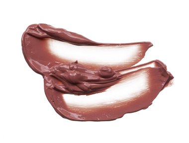 Doku beyaz arka plan üzerinde izole kahverengi ruj. Smear kırık kahverengi dudak parlatıcısı veya krem göz farı beyaz bir arka plan üzerinde izole. Beyaz izole kahverengi krem Vakfı doku