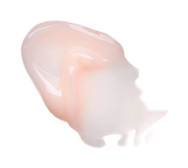 Beyaz arka plan üzerinde izole yavaşça pembe kremalı doku. Beyaz arka plan üzerinde yüz kremi smear