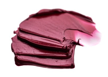 Mat ruj beyaz arka plan üzerinde izole kırmızı makyaj smear. Beyaz arka plan üzerinde izole kırmızı krem ruj doku