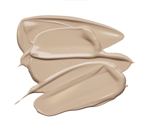 Light beige makeup smear of creamy foundation isolated on white background. Light beige creamy foundation texture isolated on white background