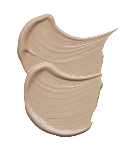 Light beige makeup smear of creamy foundation isolated on white background. Light beige creamy foundation texture isolated on white background