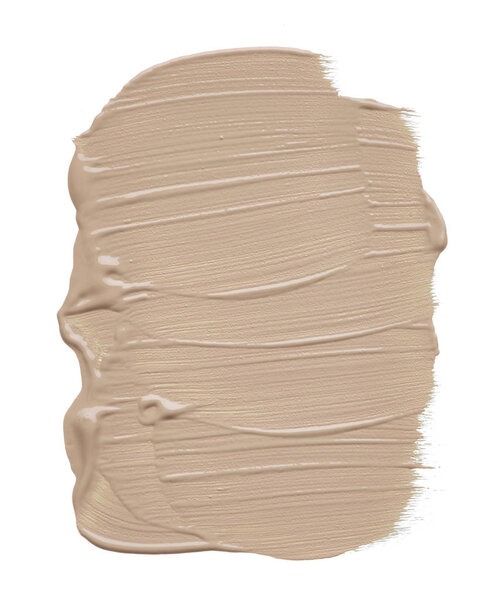 Light beige makeup smear of creamy foundation isolated on white background. Light beige creamy foundation texture isolated on white background