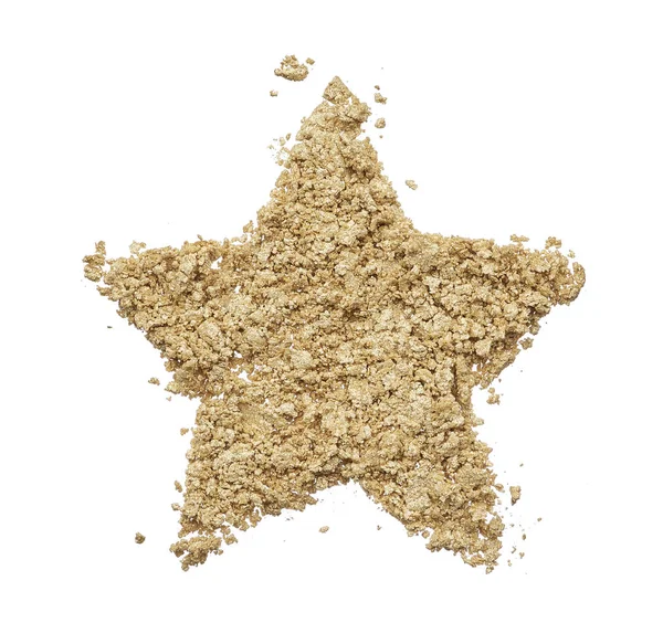 Crushed texture of beige eye shadow isolated on white background. Texture of broken golden powder in the form of a star on white background