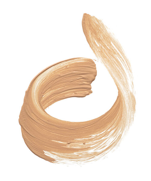 Light beige makeup smear of creamy foundation isolated on white background. Light beige creamy foundation texture isolated on white background