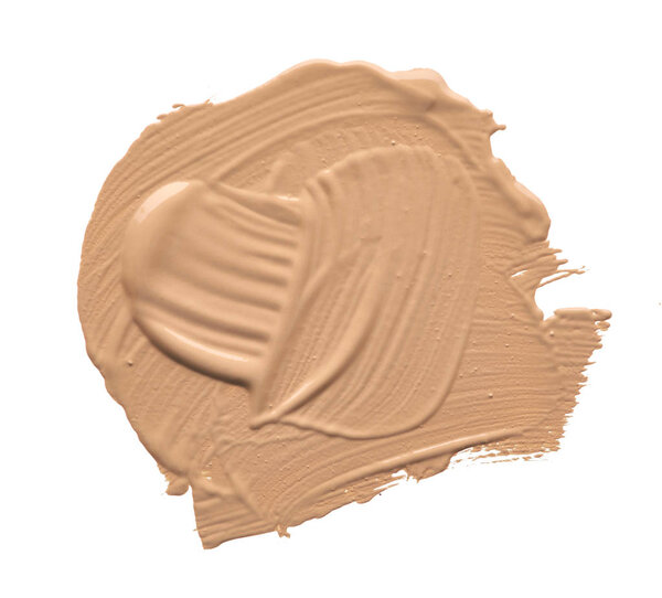 Light beige makeup smear of creamy foundation isolated on white background. Light beige creamy foundation texture isolated on white background