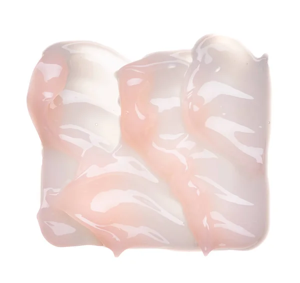 白い背景に分離されて優しくピンクのクリーミーな質感 白い背景の上の顔のクリームの汚れ — ストック写真