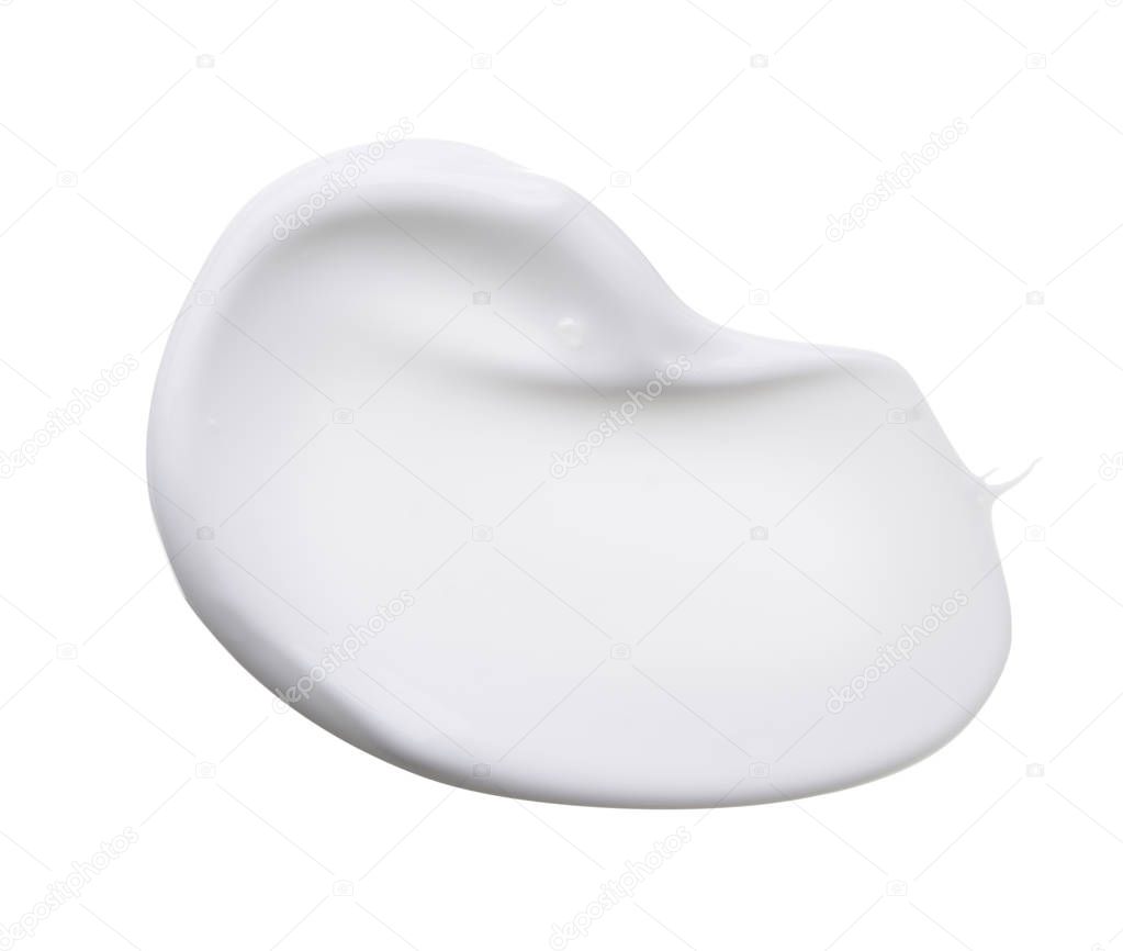 White smear of cosmetic cream isolated on white background. Creamy foundation texture isolated. Smear of white face cream isolated. Texture of cream