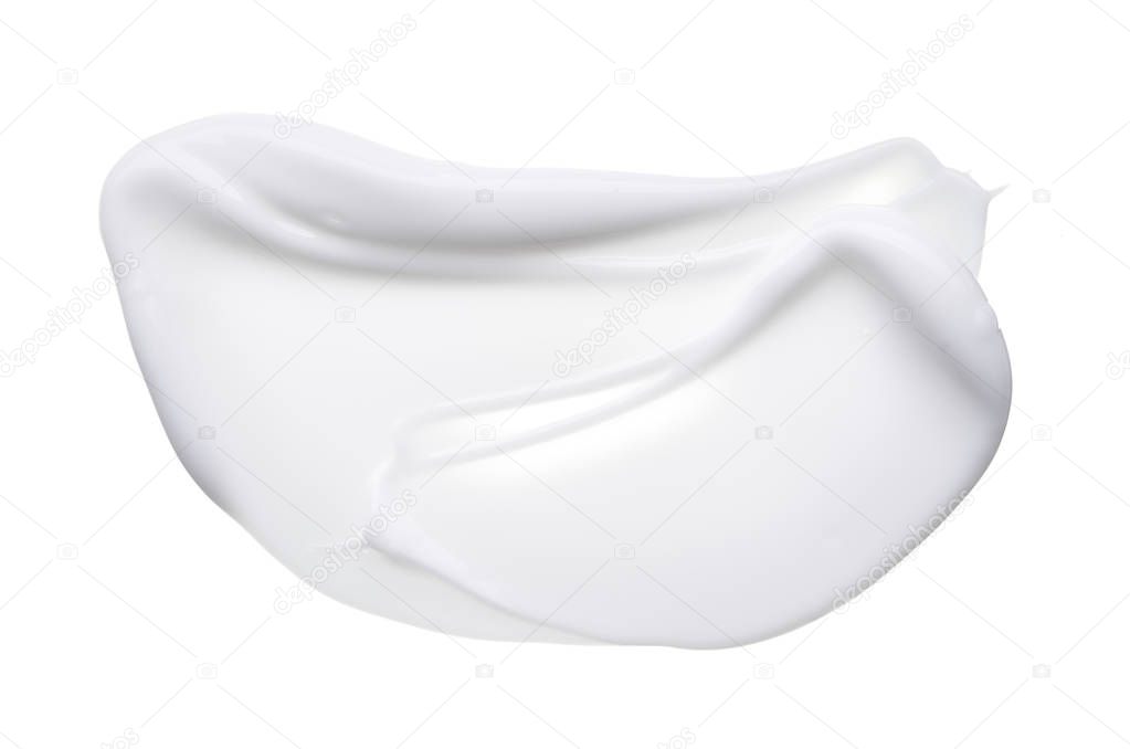 White smear of cosmetic cream isolated on white background. Creamy foundation texture isolated. Smear of white face cream isolated. Texture of cream