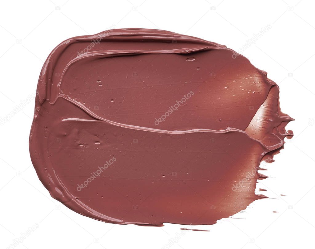 Texture of brown lipstick isolated on white background. Smear of broken brown lip gloss or creamy eye shadow isolated on a white background. Brown creamy foundation texture isolated on white