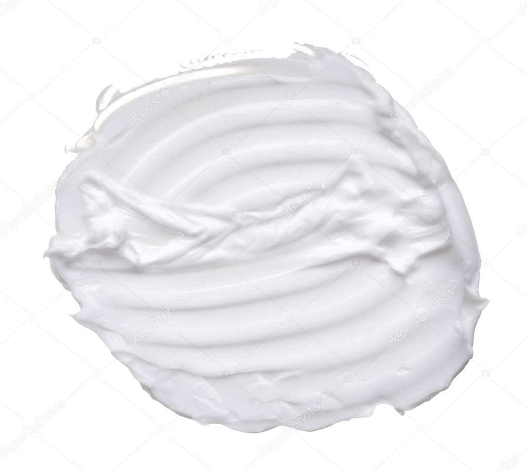 White ?reamy texture isolated on white background. Smear of face cream on white background