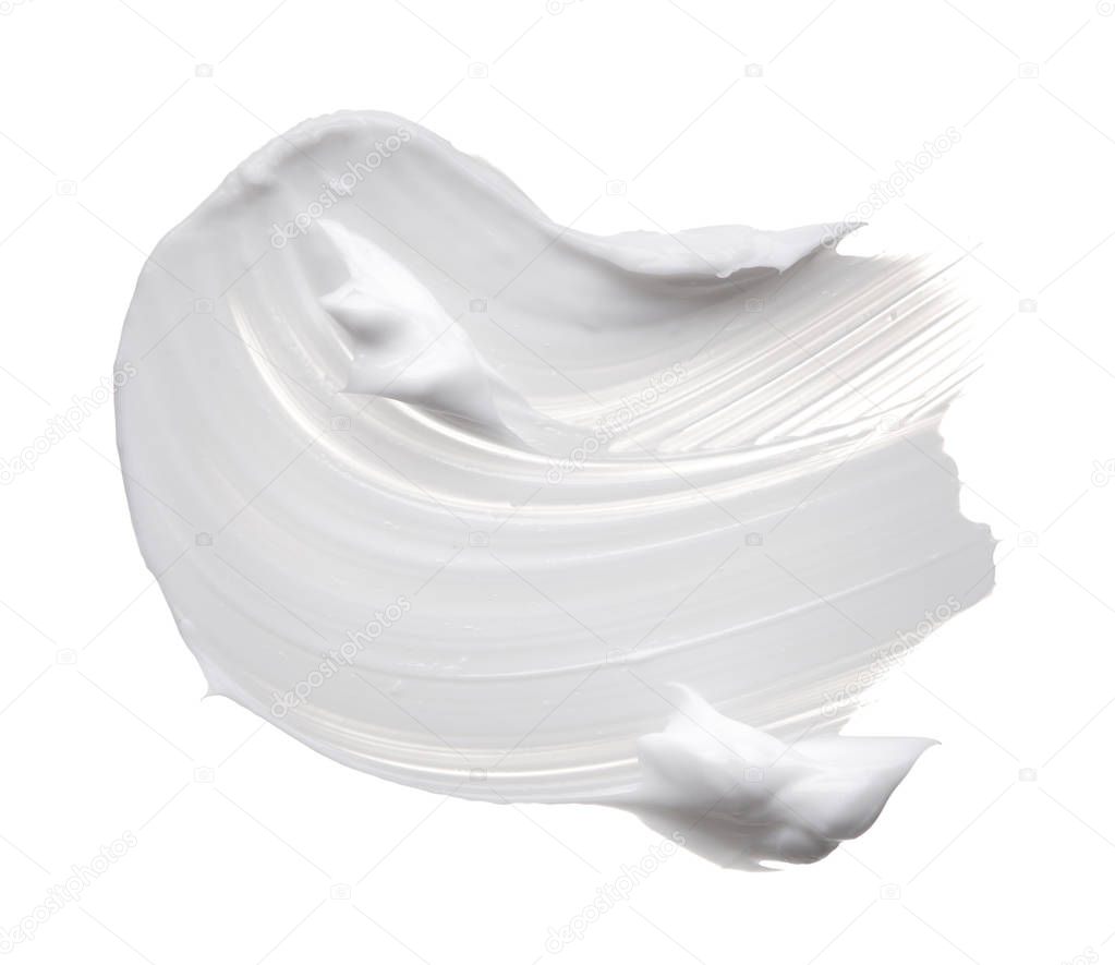 White ?reamy texture isolated on white background. Smear of face cream on white background