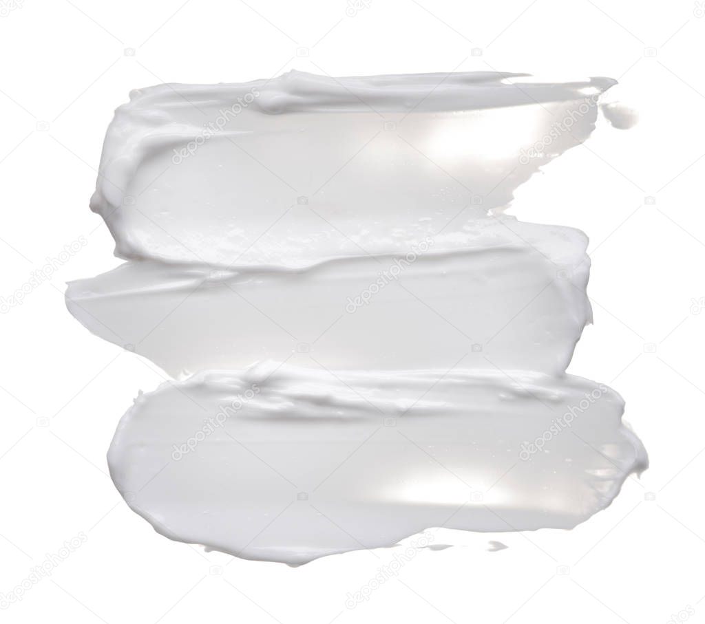 White ?reamy texture isolated on white background. Smear of face cream on white background