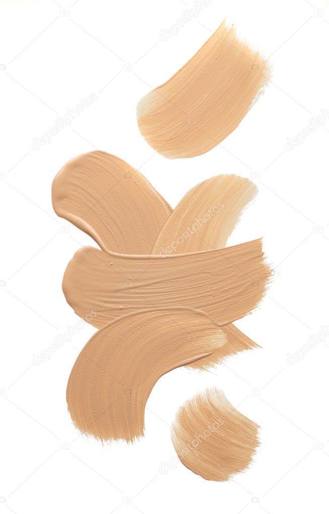 Light beige makeup smear of creamy foundation isolated on white background. Light beige creamy foundation texture isolated on white background