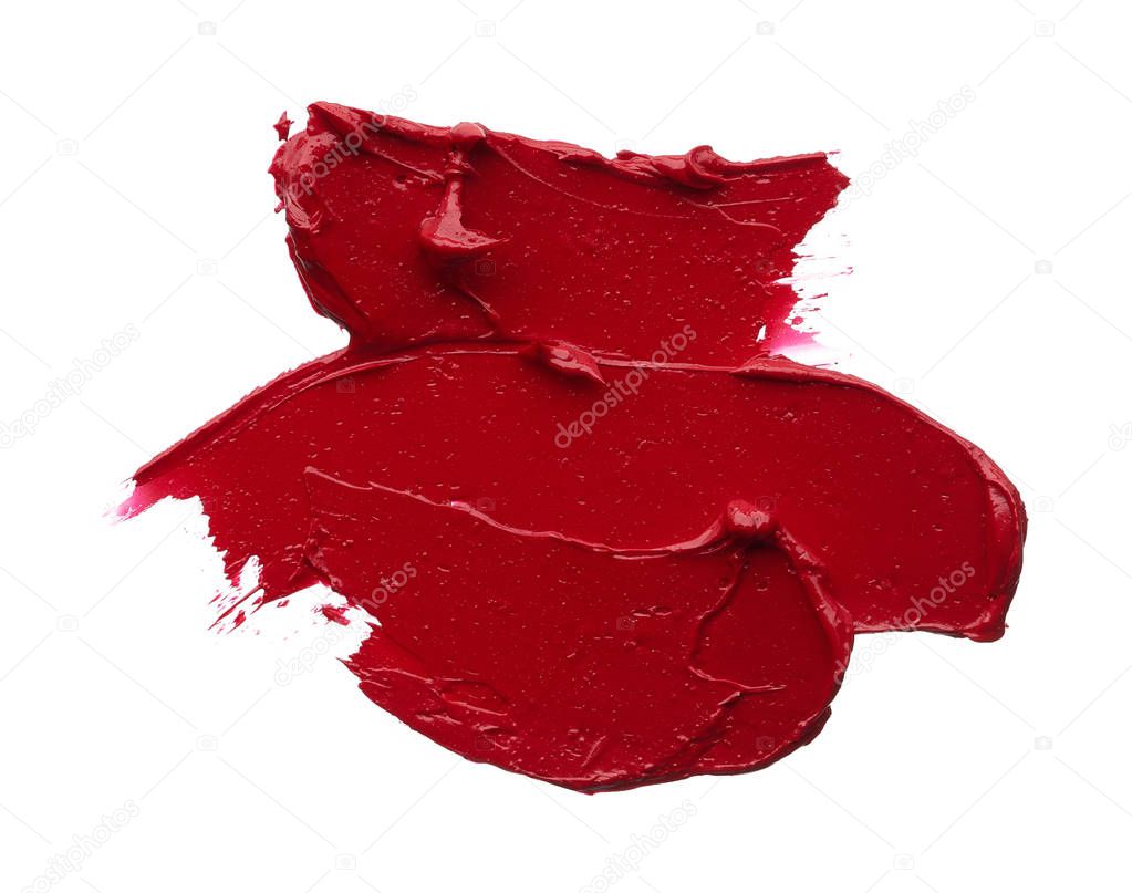 Red makeup smear of matte lip gloss isolated on white background. Red creamy lipstick texture isolated on white background