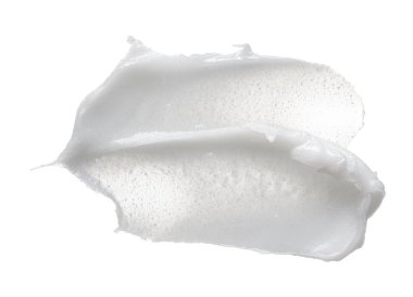 Beyaz smear kozmetik krem beyaz arka plan üzerinde izole. Kremsi Vakfı doku izole. İzole yüz kremi yayma. Krem arka plan dokusu