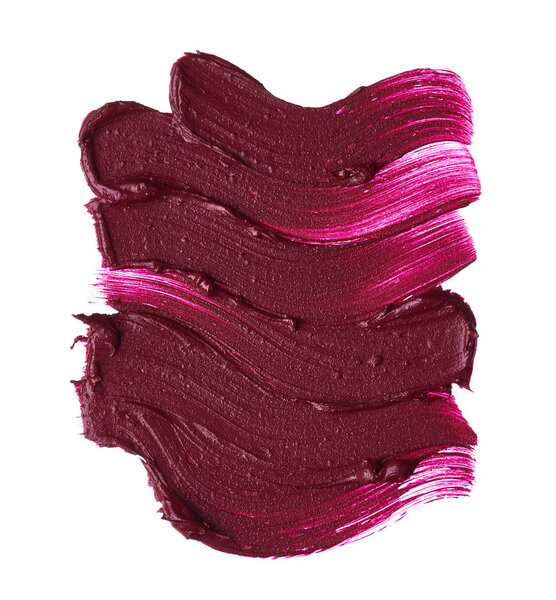 Dark red smear of matte lip gloss isolated on white background. Red creamy lipstick texture isolated on white background