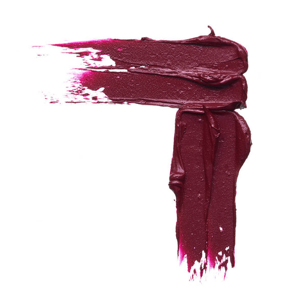 Dark red smear of matte lip gloss isolated on white background. Red creamy lipstick texture isolated on white background