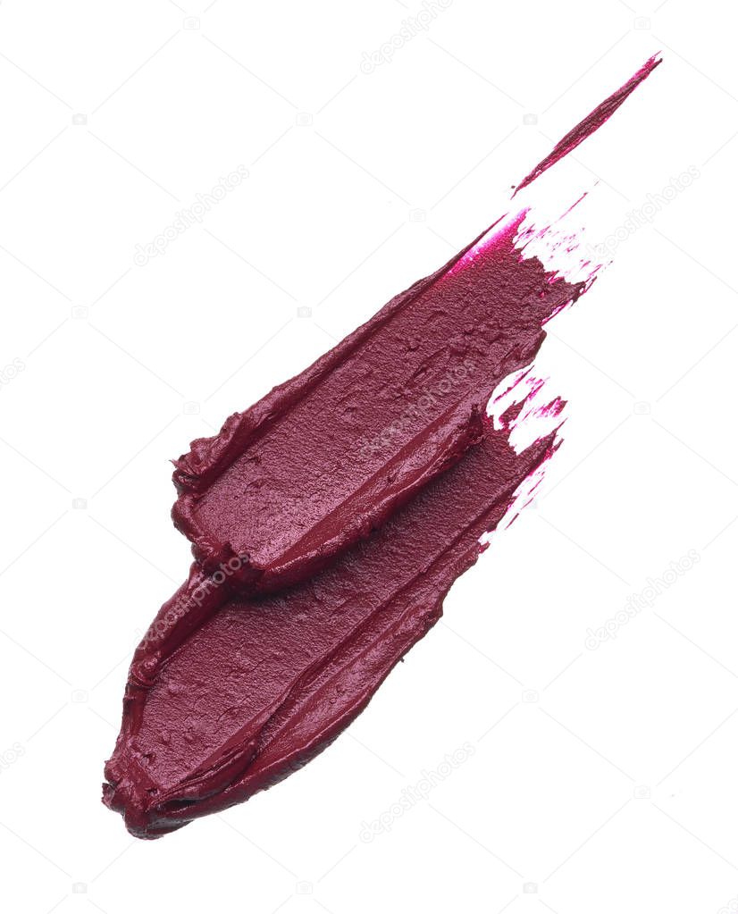 Dark red smear of matte lip gloss isolated on white background. Red creamy lipstick texture isolated on white background