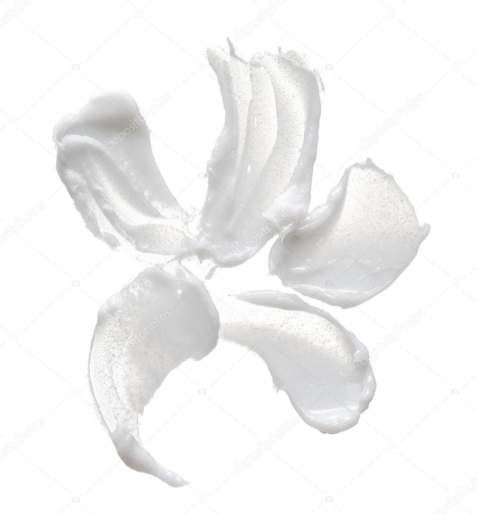 White smear of cosmetic cream isolated on white background. Creamy foundation texture isolated. Smear of face cream isolated. Texture of cream background