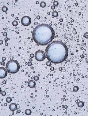 Full frame of the textures formed by the bubbles and drops of oil in the shape of circle floating clipart
