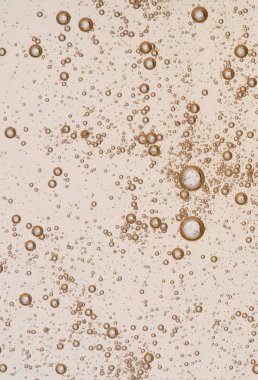 Full frame of the textures formed by the bubbles and drops of oil in the shape of circle floating clipart