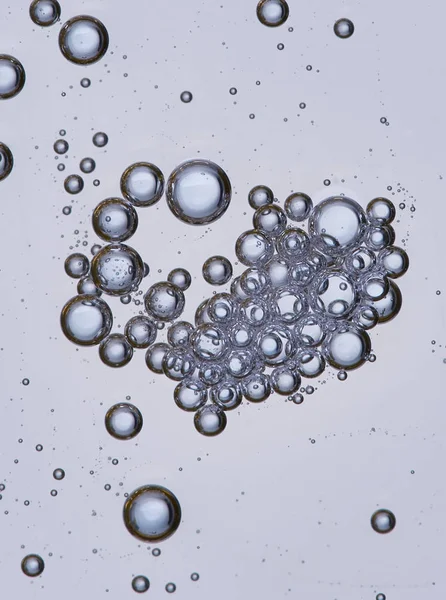 Full frame of the textures formed by the bubbles and drops of oil in the shape of circle floating