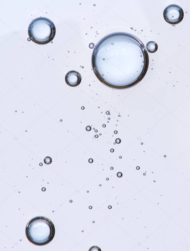 Full frame of the textures formed by the bubbles and drops of oil in the shape of circle floating