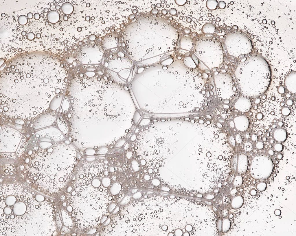 Full frame of the textures formed by the bubbles and drops in the shape of circle floating