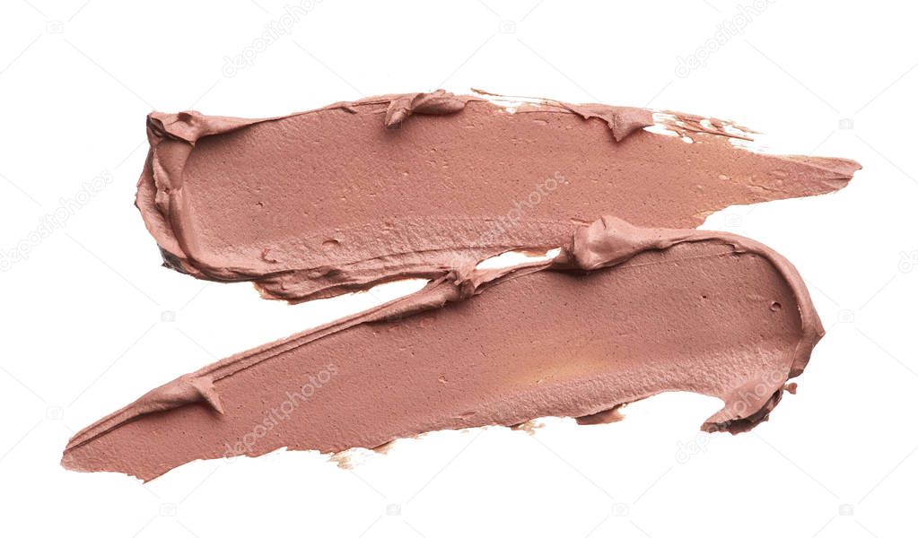 Light beige makeup smear of creamy foundation isolated on white background. Light beige creamy foundation texture background