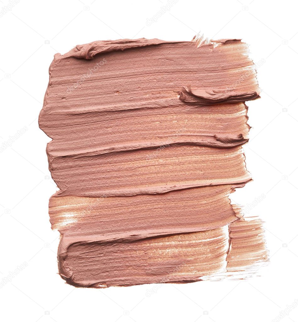 Light beige makeup smear of creamy foundation isolated on white background. Light beige creamy foundation texture background