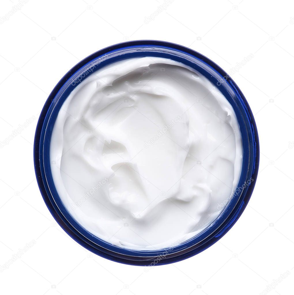 White beauty cream in a jar on a white background