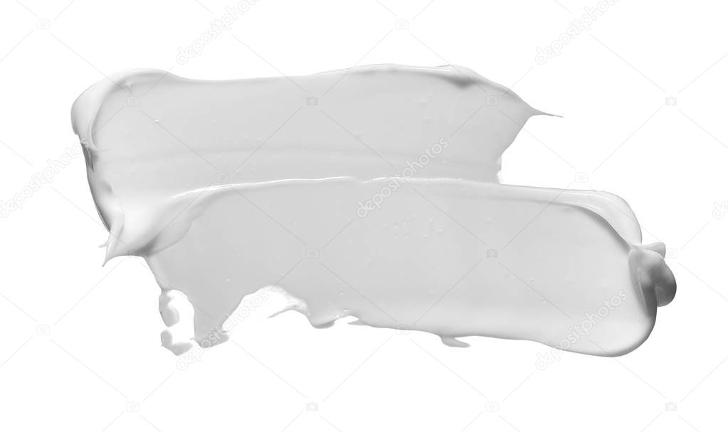 White smear of cosmetic cream isolated on white background. White creamy foundation texture isolated on white background