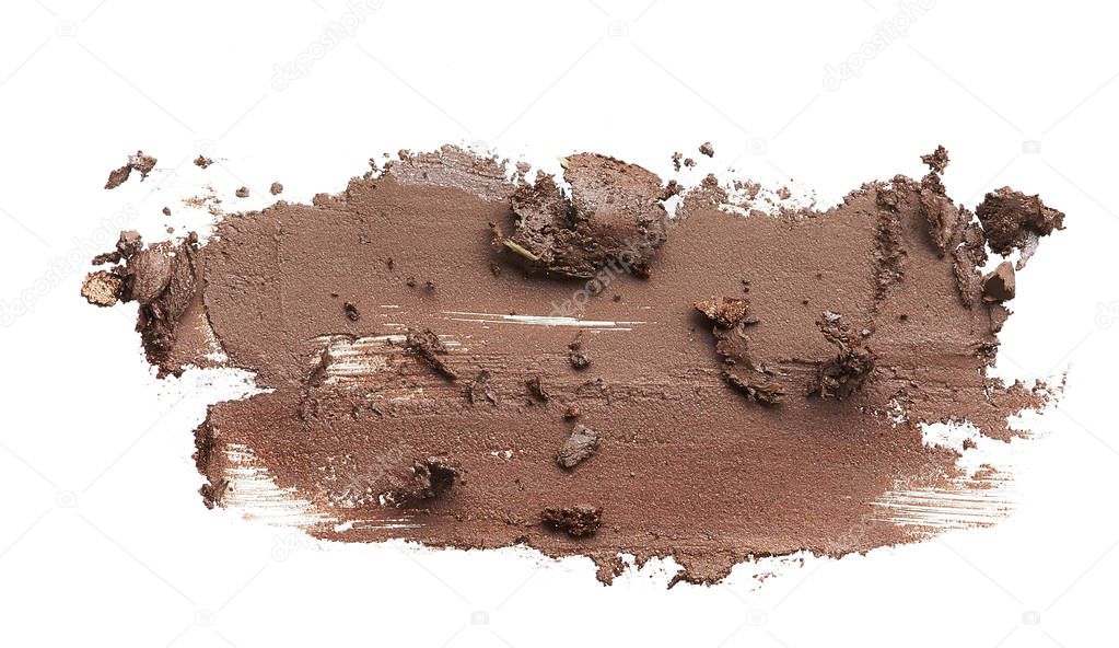 Blurred brown eyebrow pencil. A stroke of brown acrylic paint is isolated on a white background