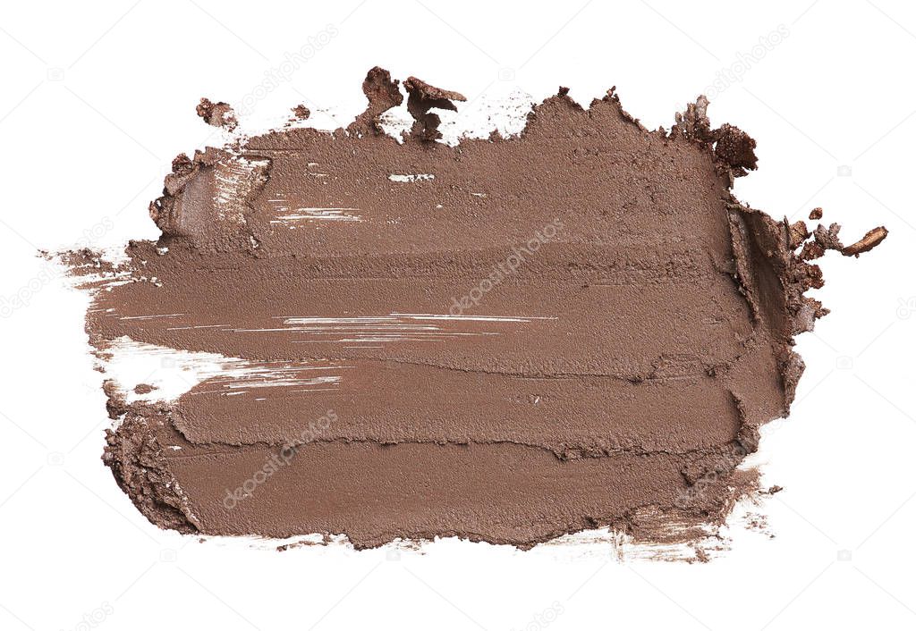 Blurred brown eyebrow pencil. A stroke of brown acrylic paint is isolated on a white background