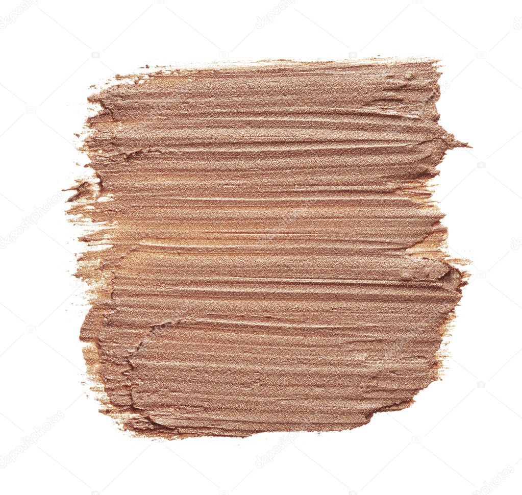 Beige makeup smear of creamy foundation isolated on white background. Beige creamy foundation texture background