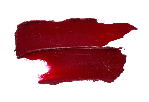 Batom vermelho ou tinta acrílica isolada sobre branco — Fotografia de Stock