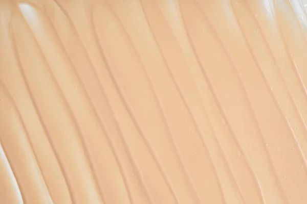 Gently beige strokes and texture of concealer — Stock Photo, Image
