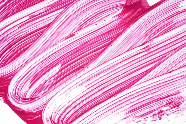 Pink strokes and texture mascara or acrylic on a white background