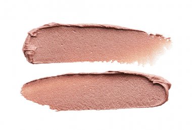 Beyaz arka planda izole edilmiş kapatıcının hafifçe bej darbeleri ve dokusu