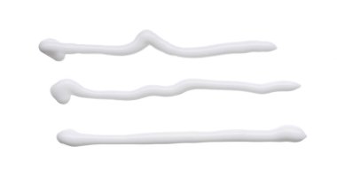 Beyaz smear ve doku yüz kil veya beyaz arka planda izole krem ile yapılan.