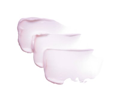 Hafifçe pembe darbeler ve yüz kremi veya beyaz arka plan üzerinde izole akrilik boya doku