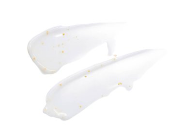 Beyaz arka planda sarı bezelye ile beyaz yüz kremi smear ve doku