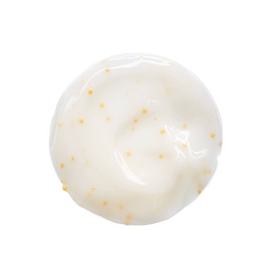 Beyaz arka planda sarı bezelye ile beyaz yüz kremi smear ve doku