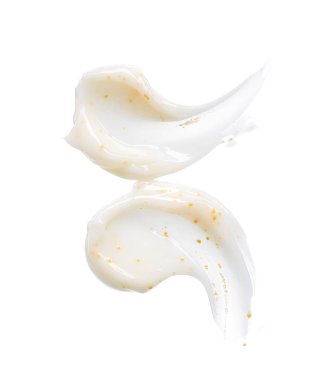 Beyaz arka planda sarı bezelye ile beyaz yüz kremi smear ve doku